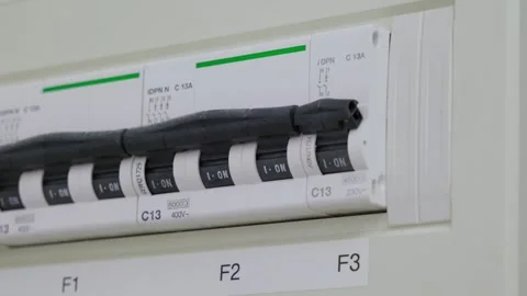 Close-up of a breaker switch being turned on and then switched off inside a Stock Footage 334059887