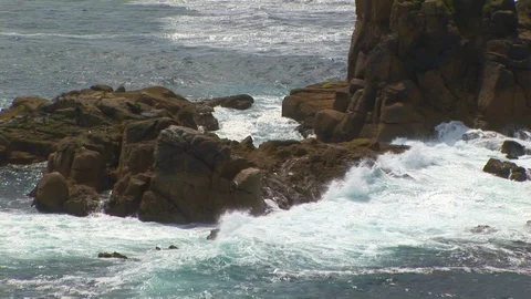 Close up of breaking waves on rocks in Cornwall, England Stock Footage 101490518