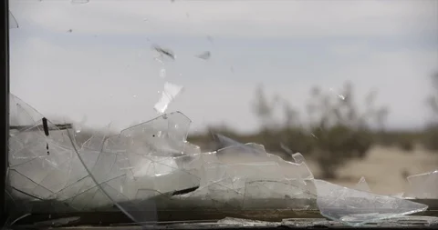 Close Up of Breaking Window Glass in Desert Stock Footage 89942036