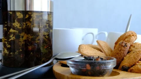 Close-up of brewing of black tea. Macro shot of tea leaves floating in boiling w Stock Footage 205069375