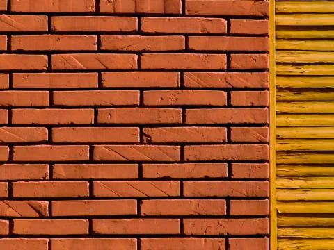 Close up of a brick wall and of a security shutter in a condominium in Rome, Ita Stock Photos