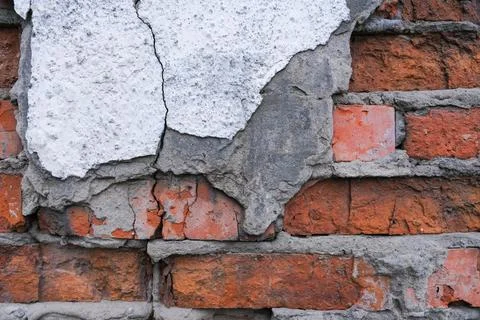 Close-up brick wall, broken red brick background, selective focus Stock Photos