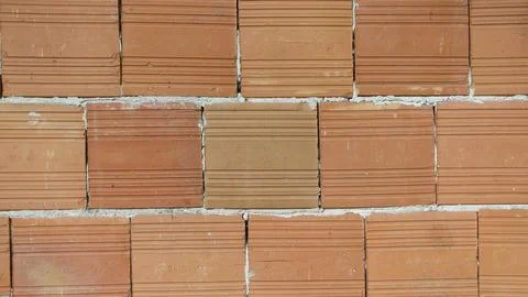 Close-up of a brick wall forming a repeating pattern 写真素材