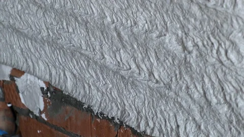 Close-up of Brick Wall. Liquid Plaster is Supplied through Construction Spray Stock Footage 168355436