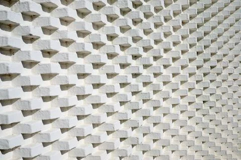 Close-up of a brick wall painted white. Stock Photos