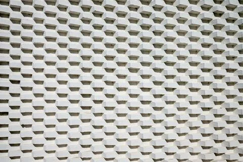 Close-up of a brick wall painted white. Stock Photos