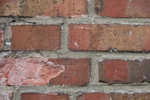Close up of brick wall with red and brown bricks Stock Photos