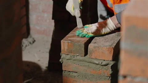 Close Up Bricklaying With Mortar and Masonry Hammer Stock-Footage 343355083