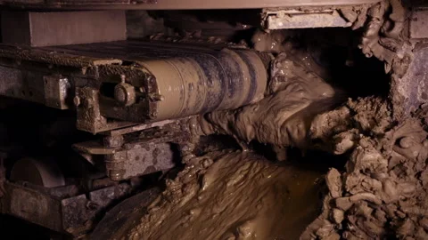 Close Up Of Bricks Pressed Onto Muddy Conveyor Belt. Wet Clay Dripping Stock Footage 155447460