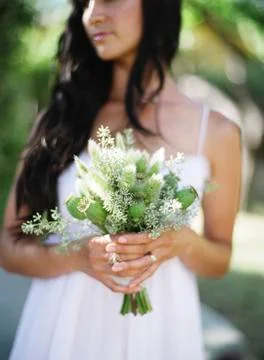 Close up of bride holding bouquet of flowers Stock Photos