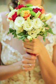 Close up of bride holding flowers Stock Photos