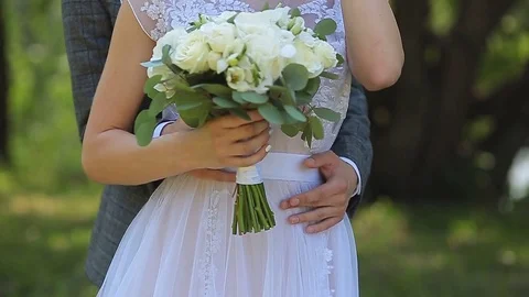 Close-up of a bride holding her wedding bouquet. Video stock 82585231