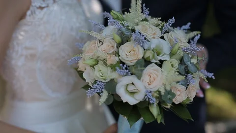 Close-up of a bride holding her wedding bouquet. Stock Footage 91397265