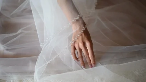 Close-up, the bride holds a fatu with one hand Stock Footage 99366677