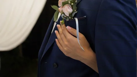 Close up  of bride hugging her groom from behind Stock Footage 119534069