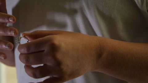 Close up bride putting on engagement ring Stock Footage 107937209