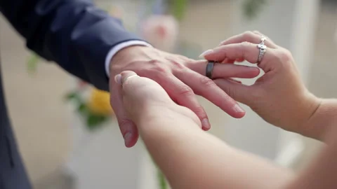 Close up of Bride putting wedding ring on Groom Stock Footage 247338508
