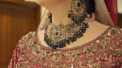 Close-Up of Bride Wearing Elegant Traditional Artificial Necklace and Bridal Jew 動画素材 343607735