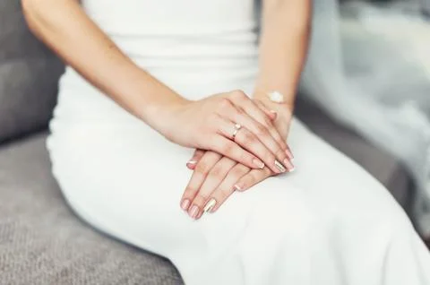 Close up of a brides hand on her lap Stock Photos
