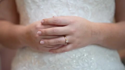 Close up of brides hands with engagement ring showing Stock Footage 278047420