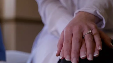 Close up on bride’s hands folded with engagement ring Stock-Footage 144123063
