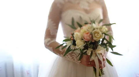 Close up of bride`s hands holding beautiful wedding bouquet of flowers of pink Stock Footage 61642639