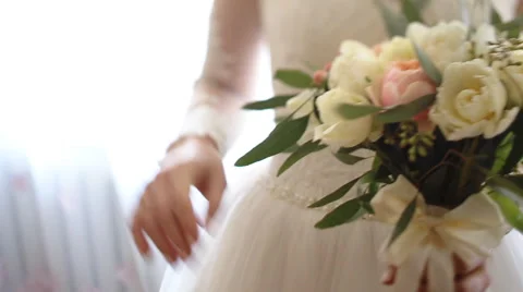 Close up of bride`s hands holding beautiful wedding bouquet of flowers of pink Stock Footage