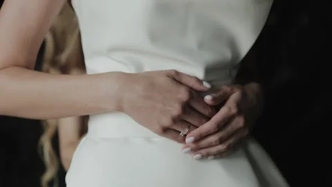 Close-up of the bride's hands holding them on her stomach Stock-Footage 308395540