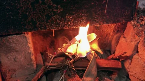 Close Up of Bright Fire Burning Inside Rustic Brick Stove Stockbeeldmateriaal 334239279