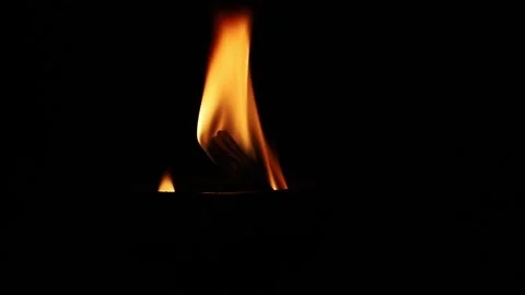Close up of a bright fire flame burning on a wooden torch or bonfire. 스톡 동영상 331276782