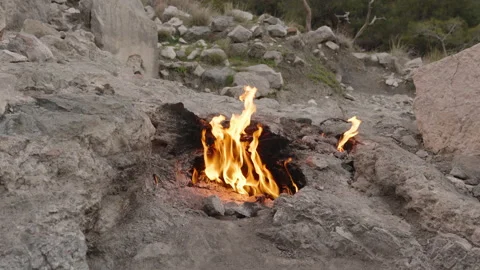 Close-Up of Bright Flames Burning from a Crack in the Ground at the Chimaera in Stock Footage 304184571