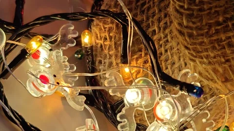 Close-up of bright glare of multi-colored lights under the Christmas tree Stock-Footage 322675635