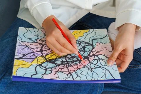 Close-up of  bright multi-colored, completed neurographics drawing. Girl dr.. Fotos Stock