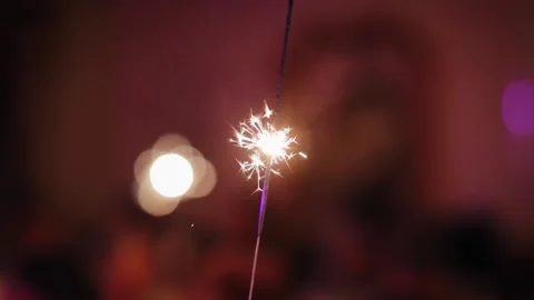 Close up of bright sparkler firework burning on some celebration. Birthday or Stock Footage 204123844