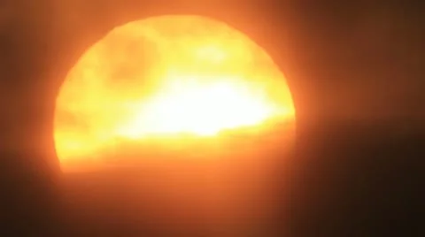 Close-up bright sun disk hides from dark sky mist Stockbeeldmateriaal 11652722