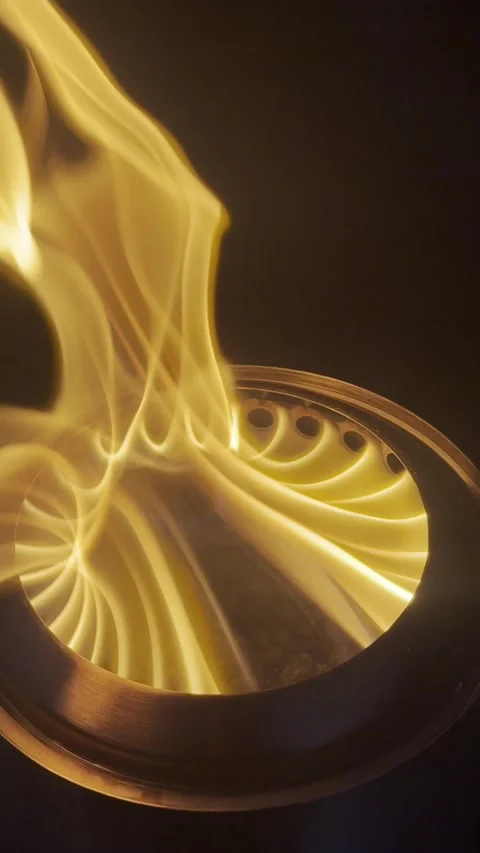 Close-up of a bright tabletop fire pit flame creating a warm outdoor atmosphere Stock Footage 340562906