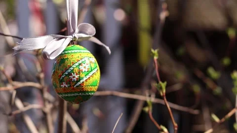 Close-up of a bright, traditionally painted Ukrainian pysanka (Easter egg) Stock Footage 332363282