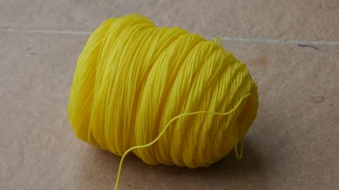 Close Up of Bright Yellow Nylon Rope Spool Stock Footage 340880352