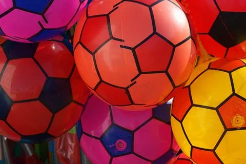 Close-up of brightly coloured inflatable rubber soccer balls Stock Photos