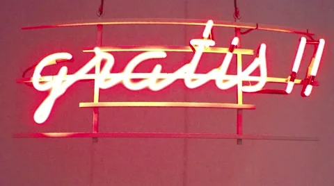 Close up of brightly glowing red neon light sign showing word gratis 4k Stock Footage 60239308