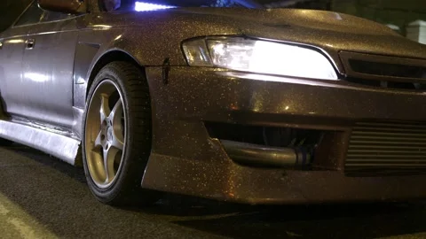 Close-up of brilliant car design. Action. Designer car cover with gold sequins Stock Footage 107311396