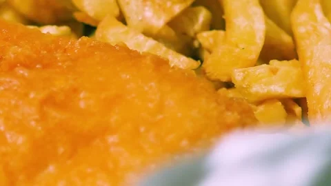 Close Up of British Fish and Chips as Camera Moves from Chips to Battered Fish Stock Footage 321894805