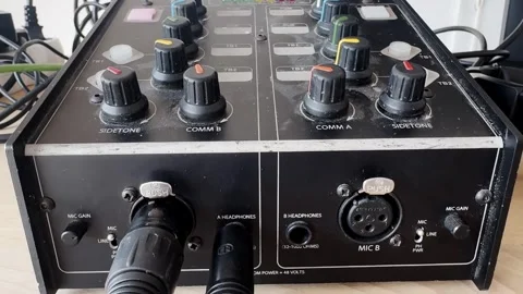 Close-up of a broadcast intercom audio control unit with comm knobs, sidetone Stock-Footage 336291608