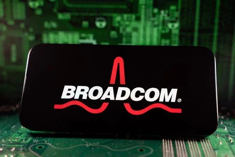 Close up of Broadcom logo on device with circuit board background. Toronto, Stock Photos