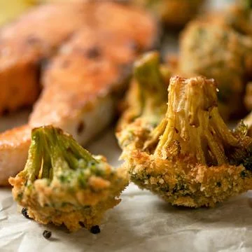 Close up of broccoli cabbage fried in breadcrumbs. Vegetable garnish for salmon Stock Photos