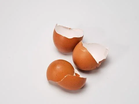 Close-up of broken brown eggshells piled together, captured in natural ligh.. Stock Photos
