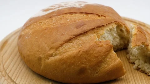 Close-up of a broken fresh Palyanytsia bread with a crispy crust Stock Footage 327775544