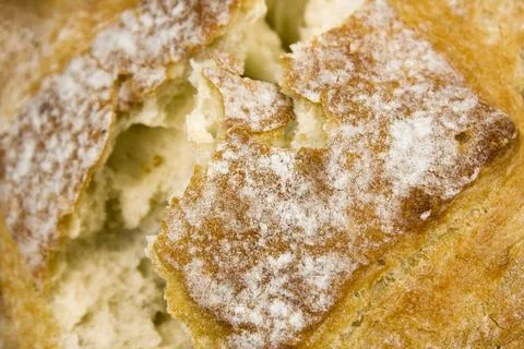 Close up of broken freshly baked bread. Texture of wheat bread. Stock Photos