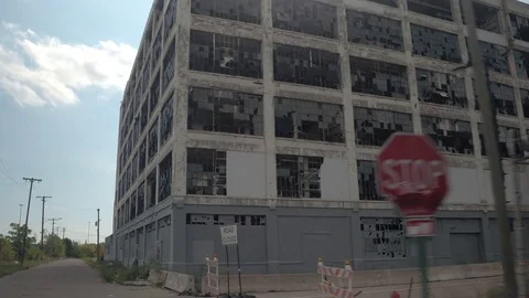 CLOSE UP: Broken glass on the windows of abandoned Fisher auto factory, Detroit Stock Footage