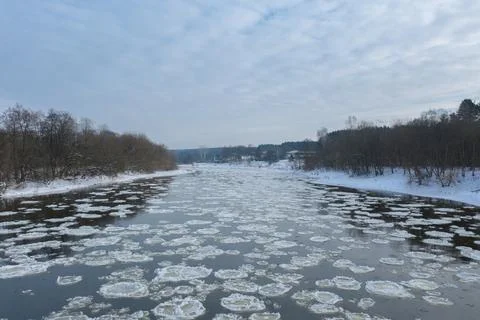 Close up of broken ice in flowing river Stock Photos